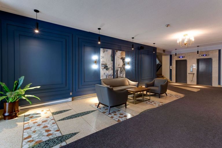 Lobby at 4875 Dufferin with seating area and two elevators